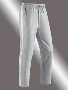 بنطلون رياضي رجالي ذو ساق مستقيمة. هذا البنطلون الرياضي الرمادي الكلاسيكي للرجال يتميز بخطوط جانبية متناوبة سميكة وخفيفة، مما يجمع بين التنوع والأناقة. أفضل اختيارات الهدايا للأزواج/الأصدقاء الذكور هذا الخريف والشتاء.