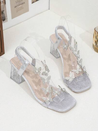 Sandales pour fille avec strass papillon transparent, talon épais transparent avec bride à la cheville argentée