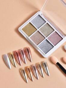 Una scatola di 6 colori con 3 bastoncini di cotone inclusi. La polvere specchio per arte di unghie è fine e non vola