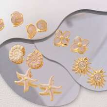 1 par de pendientes florales dorados de acero inoxidable chapado elegantes y de moda