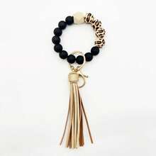 A Leopard Print Silicone Wood Bead Bracelet Keychain With PU Leather Tassels, Fashionable Bag Dration, And Women's Gift