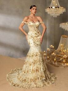 Faeriesty Chiếc đầm dạ hội trễ vai thanh lịch này nổi bật với họa tiết thêu vàng tinh tế, kiểu dáng đuôi cá và thiết kế thắt eo, rất phù hợp để tham dự các buổi dạ tiệc sang trọng, đám cưới, dạ hội từ thiện, lễ trao giải và các sự kiện trang trọng khác. - Rượu sâm banh - Xem 1