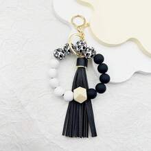 A Leopard Print Silicone Wood Bead Bracelet Keychain With PU Leather Tassels, Fashionable Bag Dration, And Women's Gift