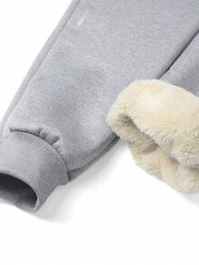 1 条男士休闲羊毛腿绑带裤，配有拉链口袋，采用厚羊毛衬里，保暖且穿着舒适惬意。