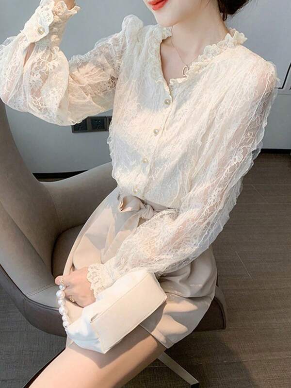Blusa elegante de manga larga con un solo botonadura, con florituras y dobladillo de encaje para mujer