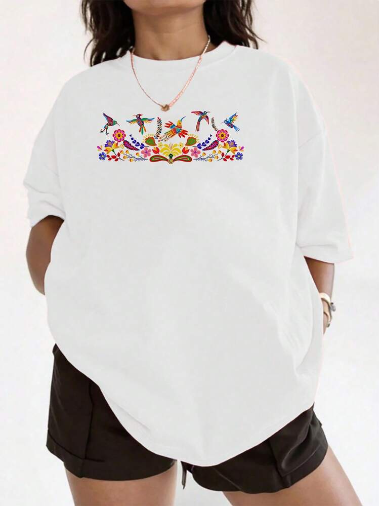 Camiseta de mujer con estampado floral y colibrí de acuarela vibrante, camiseta con gráfico artístico de pájaro para mujer, top con estampado floral caprichoso, ropa diaria ligera y cómoda, camisa casual de diseño expresivo de gran tamaño - Blanco - Añade 1