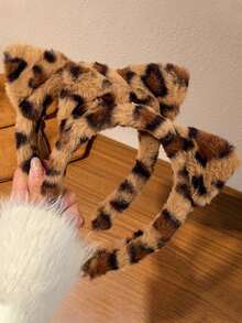 Orelhas de gato de pelúcia com estampa de leopardo