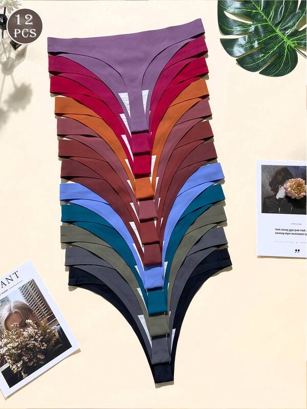 Pacote com 12 calcinhas fio dental sem costura para mulheres, modelo simples e moderno, cintura baixa, elásticas, respiráveis e confortáveis.