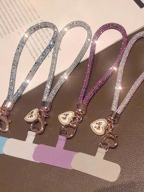 Laccetto per telefono di lusso con strass, accessorio da polso, braccialetto corto chic con ciondolo a farfalla e cuore