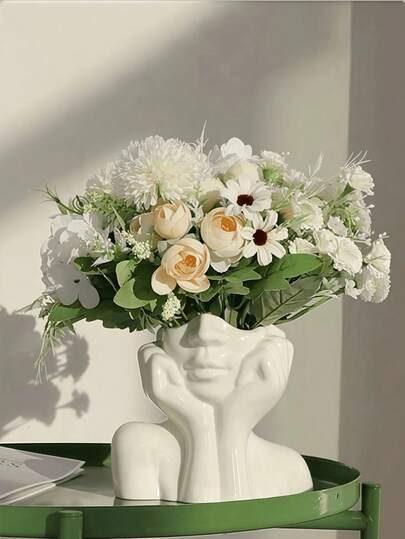 This Design Features An Exquisite Vase Shape, Presenting A Woman's Pose Of Cupping Her Face. The Design Is Simple Yet Fashionable, With The Unique Cupping Hands Pose Full Of Charm. It Is Very Suitable For Holding Fresh Flowers Or Artificial Flowers, And Can Also Be Used For Storing Cosmetics. Suitable For All Seasons, It Is An Ideal Decoration For The Living Room And Bedroom, And A Must-Have For Daily Home Decor.