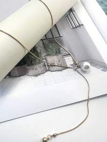 1 件可调节金色珍珠长项链，适合日常佩戴，是送给女性的最佳礼物