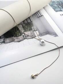 1 件可调节金色珍珠长项链，适合日常佩戴，是送给女性的最佳礼物