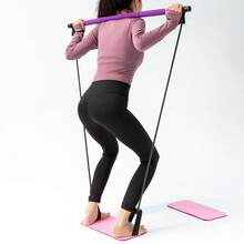 Lila Pilates Stab für Fitness im Innenbereich
