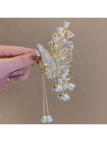 1个女孩酷炫花朵蝴蝶水钻仿珍珠流苏大发夹，锌合金材质，仙女女孩的理想礼物配饰，适合女性，秋季，旅行，美发工具，女士配饰，发饰，秋季，女士，美发工具，发饰，发饰，美容配饰，礼物，旅行，送给女性的礼物，发饰，女士，圣诞礼物，成人圣诞礼物，成人圣诞礼物，发饰，女士配饰，圣诞礼物，成人发饰，送给女性的礼物创意，美容圣诞礼物，送给女性的礼物 - 金色 - 查看 9