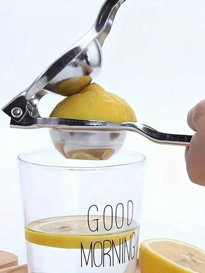 榨汁机。重型不锈钢手动柑橘榨汁机。坚固底座，适用于柠檬、橙子和西柚 - 易于清洁的厨房工具，适用于家庭、餐厅和酒吧。无需电源，便携式榨汁机，光滑的金属表面，耐用的厨具，紧凑的设计，坚固的结构，家庭烹饪的必备之选。