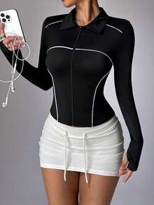 Veste de yoga ajustée zippée à couleurs contrastées, style sportif chic pour femmes. Design élégant pour l'entraînement, la vie quotidienne et les tenues décontractées