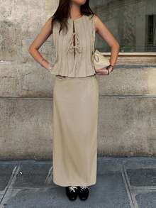 两件套女士休闲无袖褶皱系带露脐上衣和低腰美人鱼长裙，包括裙子、配套吊带背心、飘逸雪纺裙、性感吊带沙滩套装、可爱蝴蝶结装饰，适合春、夏、秋季穿着。