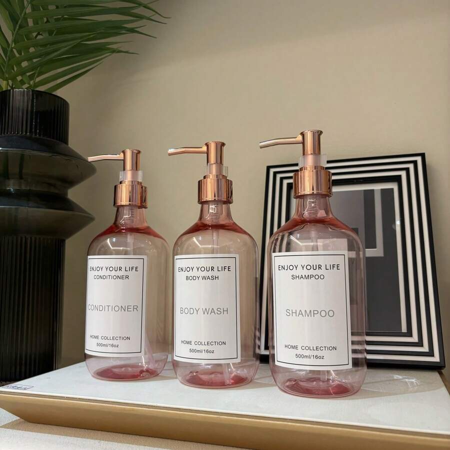 3个500毫升/16盎司玫瑰粉色可再填充泵瓶，带玫瑰金泵头，适用于洗发水、沐浴露、护发素、酒店浴室乳液瓶，带防水标签 - Translucent Pink - 查看 1