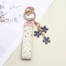 1 breloc elegant din piele PU imprimat cu inel din aliaj de zinc rezistent la rugină, accesoriu de modă pentru femei la modă, potrivit pentru chei auto, chei de ușă și cadouri, breloc, breloc la modă, durabil și robust.