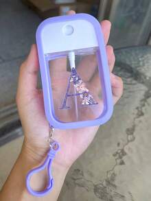 1 chai xịt khử trùng tay dưỡng ẩm, 26 chữ cái màu tím, chai xịt du lịch di động 50ml, giá đựng nước rửa tay bằng silicon có móc khóa, thiết kế quấn toàn bộ, có dây đeo, dễ sử dụng, chất liệu silicon mềm, di động khi đi du lịch, vật dụng cần thiết hàng ngày, du lịch, công việc hàng ngày, vật dụng cần thiết cho trường học, có móc khóa chữ cái màu tím để dễ dàng nhận biết (Sản phẩm này không chứa, vui lòng thêm nước sau khi nhận và mở) - Màu tím - Xem 14