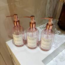 3个500毫升/16盎司玫瑰粉色可再填充泵瓶，带玫瑰金泵头，适用于洗发水、沐浴露、护发素、酒店浴室乳液瓶，带防水标签 - Translucent Pink - 查看 7