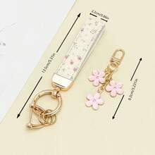 1 breloc elegant din piele PU imprimat cu inel din aliaj de zinc rezistent la rugină, accesoriu de modă pentru femei la modă, potrivit pentru chei auto, chei de ușă și cadouri, breloc, breloc la modă, durabil și robust.