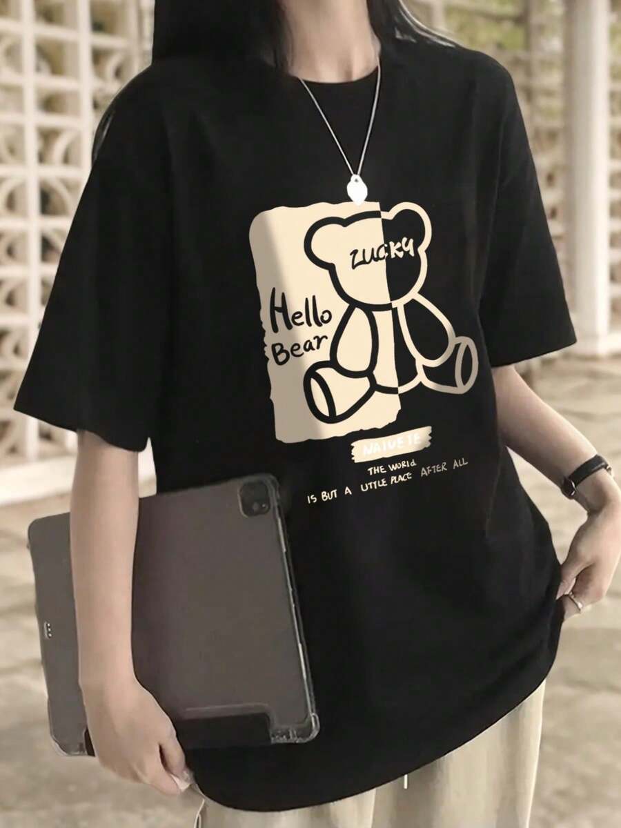 Camiseta informal de algodón con hombros caídos y manga corta para mujer con estampado gráfico de oso de la suerte, cuello redondo, para verano - Negro - Ver 1