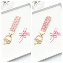 1 breloc elegant din piele PU imprimat cu inel din aliaj de zinc rezistent la rugină, accesoriu de modă pentru femei la modă, potrivit pentru chei auto, chei de ușă și cadouri, breloc, breloc la modă, durabil și robust.