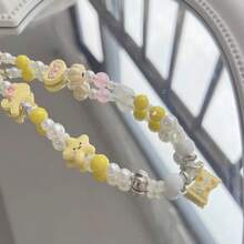 Braccialetto delicato con ciondoli a forma di stella gialla, fiocco e cuore, catena e laccetto da polso per donna