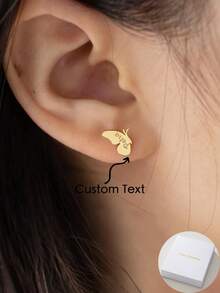 A Pair Of Bespoke Monogrammed Butterfly Wing Stud Earrings, Crafted From Stainless Steel. These Minimalist Butterfly Studs Feature A Distinctive, Understated Design. Perfect As A Gift For Her On Occasions Such As Christmas, Valentine's Day, Birthdays, Or Anniversaries. - Yellow Gold - View 1