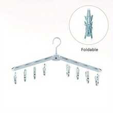 便携式折叠晾衣架，防风设计，配有8个夹子，可晾晒袜子、裤子、衬衫；360°旋转塑料衣架，烤漆表面处理，节省空间，是旅行和居家衣橱收纳的理想之选。经久耐用，易于安装，小巧的晾衣架可快速晾干衣物，用途广泛，适合居家或旅行使用。是宿舍、公寓、小户型以及繁忙家庭寻求整洁洗衣收纳的理想之选。 - 彩色 - 查看 4