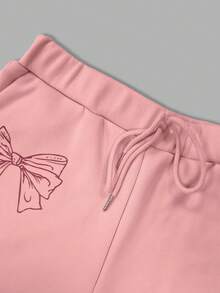 Ensemble 2 pièces femme, Sweat-shirt à capuche manches longues en polaire élégant et casual avec imprimé nœud, et pantalon assorti avec cordon de serrage, pour le début de l'automne