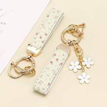 1 breloc elegant din piele PU imprimat cu inel din aliaj de zinc rezistent la rugină, accesoriu de modă pentru femei la modă, potrivit pentru chei auto, chei de ușă și cadouri, breloc, breloc la modă, durabil și robust.