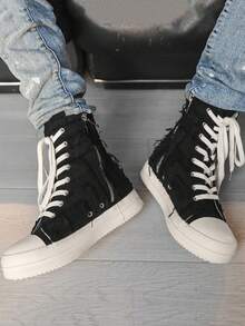 Zapatos casuales de lona de estilo personalizado de moda para hombres en otoño/invierno, botas de estilo de cremallera y flecos desgastados de suela de goma marfil de nicho de alta top