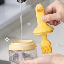 1 pieza Botella de aceite para barbacoa con forma de pato de dibujos animados, incluye un cepillo de aceite, agarre de silicona, puede contener aceite en su interior, cepillo para hornear, cepillo para barbacoa, fácil de limpiar, utensilio de cocina, diseño súper lindo, botella de aceite integrada.