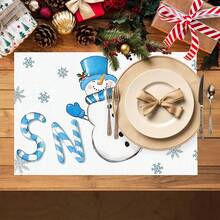 1/4/6 pièces Dessous de plat décoratifs avec bonhomme de neige portant un chapeau Top de forme bleu, décoré de feuilles de houx et de baies rouges, enveloppé dans une écharpe rayée bleu et blanc, avec des gants bleus imprimés