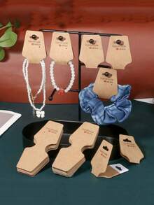 50pcs Foldable Cardboard Necklace Packaging Cards, Elastic Hang Tags, Blank Folding Black & White Kraft Paper Hair Accessory Cards For DIY Beaded Jewelry, Necklace, Bracelet Packaging, Great Gifts For Dad, Mom, Friends, Teachers, Students, Weddings