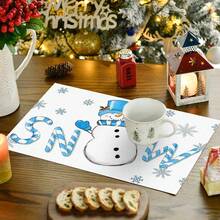 1/4/6 pièces Dessous de plat décoratifs avec bonhomme de neige portant un chapeau Top de forme bleu, décoré de feuilles de houx et de baies rouges, enveloppé dans une écharpe rayée bleu et blanc, avec des gants bleus imprimés