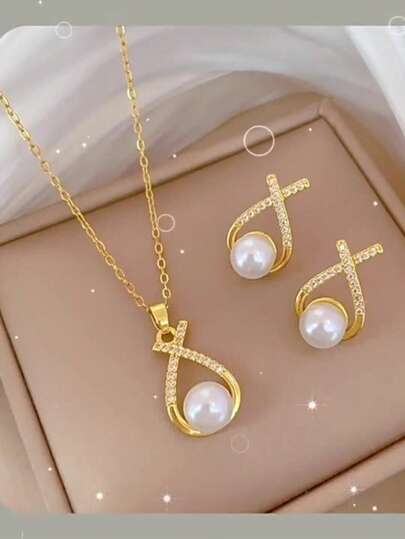 Un elegante conjunto de pendientes y collar con microincrustraciones y perlas falsas cruzadas. Diseño exquisitamente coordinado. Perfecto para uso diario, fiestas o como regalo para el Día de la Madre o San Valentín