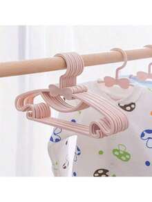 Cuier pentru haine pentru copii, 10 buc/1 buc, fabricat din material PP, suport de uscare a hainelor de acasă, suport pentru haine drăguț, antiderapant și anti-cădere, cuier pentru haine pentru nou-născuți, cuier pentru depozitarea dulapului cu papion, robust și durabil, cu cârlige, cuier multifuncțional pentru haine uscate și umede, două în unu cu fundă, potrivit pentru copii cu vârsta cuprinsă între 0 și 10 ani, cuier și clemă esențiale pentru depozitarea acasă