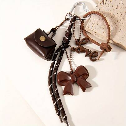1 pezzo Borsetta/portachiavi mini in corda intrecciata e pelle sintetica nera e marrone, con fiocco e ciondolo a forma di cuore - fiocco marrone, fili di perline e design a righe bianche e nere, borsa a mano mini in finta pelle 3D