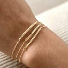 This Exquisite And Simple Narrow Bracelet Can Be Customized With Your Initials, Roman Numerals, Or The Date. Made Of Gold, It Makes A Perfect Gift.
