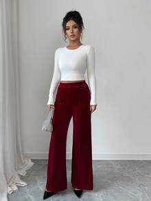 Burgundy Knitted Fabric Flare Leg Long Pants For Women With Exposed Seam Detail Medium Stretch