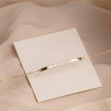 This Exquisite And Simple Narrow Bracelet Can Be Customized With Your Initials, Roman Numerals, Or The Date. Made Of Gold, It Makes A Perfect Gift.
