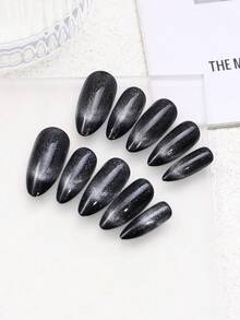 Juego de 24 piezas de uñas acrílicas falsas con diseño de ojo de gato en blanco y negro estilo Y2K, de forma almendrada larga con cielo estrellado en blanco y negro, que incluye 1 parte de pegamento de gelatina y 1 parte de lima de uñas, adecuado para uso diario de mujeres y suministros para fiestas de carnaval