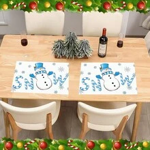 1/4/6 pièces Dessous de plat décoratifs avec bonhomme de neige portant un chapeau Top de forme bleu, décoré de feuilles de houx et de baies rouges, enveloppé dans une écharpe rayée bleu et blanc, avec des gants bleus imprimés