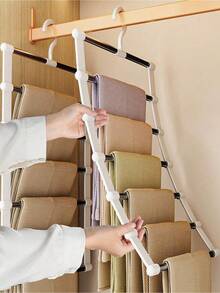 1个多功能裤架，带梯形可折叠不锈钢架 – 多层防滑裤架，适用于衣柜，节省空间，可折叠裤架，带防滑手柄，优质防锈结构，方便取用悬挂系统，承重力强，轻巧坚固，按款式分类裤子，是春季衣橱改造的理想之选，让您的裤子整齐、干净、时尚地展示在家中、公寓、宿舍衣柜中。 - 彩色 - 查看 1