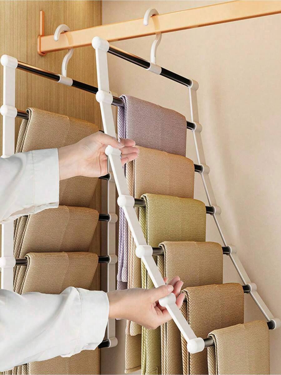 1个多功能裤架，带梯形可折叠不锈钢架 – 多层防滑裤架，适用于衣柜，节省空间，可折叠裤架，带防滑手柄，优质防锈结构，方便取用悬挂系统，承重力强，轻巧坚固，按款式分类裤子，是春季衣橱改造的理想之选，让您的裤子整齐、干净、时尚地展示在家中、公寓、宿舍衣柜中。 - 彩色 - 查看 1