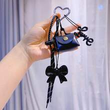 1 件黑咖啡手工编织绳和 PU 皮革迷你包钱包钥匙扣，带蝴蝶结和心形吊饰 - 棕色蝴蝶结、串珠绳和黑白条纹设计，3D 仿皮迷你手提包 - 彩色 - 查看 5