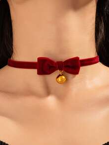 Un lindo collar de peluche de Año Nuevo y Navidad para niña, con lazo rojo dulce, campana y cadena de clavícula